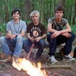 Junior Elementary Bushcraft Course Residential Three boys in front of a campfire on a junior bushcraft course