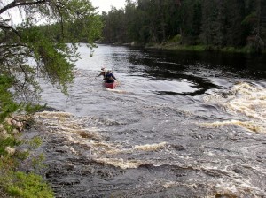Men in a canoe.