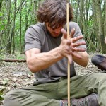 Intermediate Wilderness Bushcraft course student with hand-drill