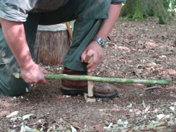 Demonstration of bow drill technique on bushcraft course