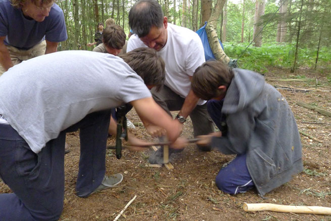 Bow-drill friction fire-lighting on a Family Bushcraft course