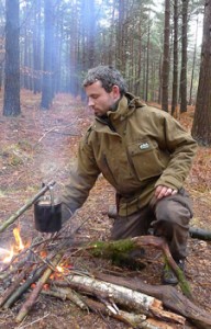 Ben Gray tending a fire