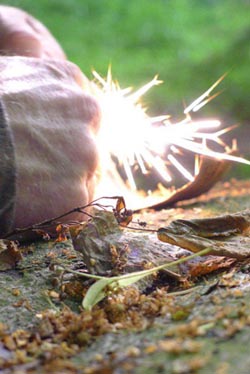 Fire lighting with sparks on the Frontier bushcraft and survival foundation course