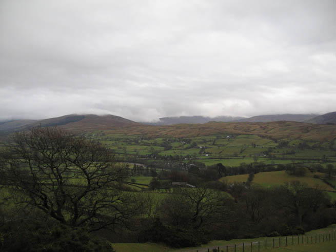 View from the lower slopes of the Howgills showing cloud dissipating from neighbouring hills