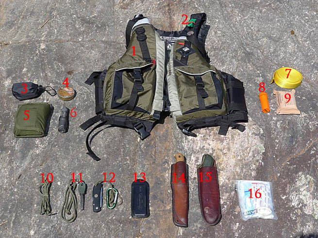 A numbered photograph of the author's personal survival kit for canoeing in the wilderness