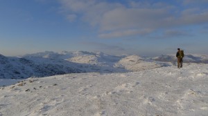 A snowy mountainscape. Crinkle Crags, Bow Fell and the Scafell range.