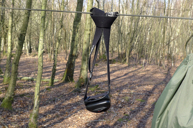 Head torch attached to hanging line by a looped cow hitch.