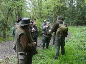 Paul and the BCUK group discussing and tasting some wild food plants