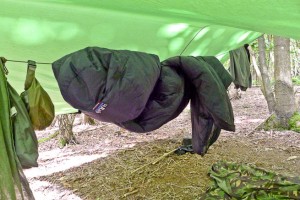 RAB Sleeping bag on hanging line under a tarp