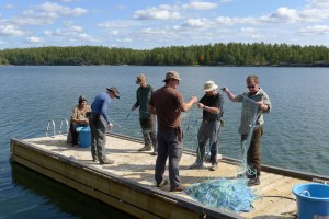 French River Expedition members preparing a fishing net