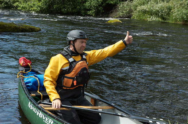Canoeist giving thumbs up sign