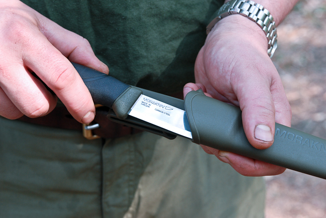 Knife being drawn from sheath