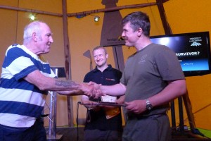 Paul Kirtley receives knife from Lofty Wiseman