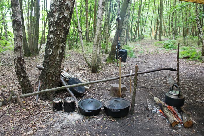 Elements of classic camprcraft help create an organised woodland camp...