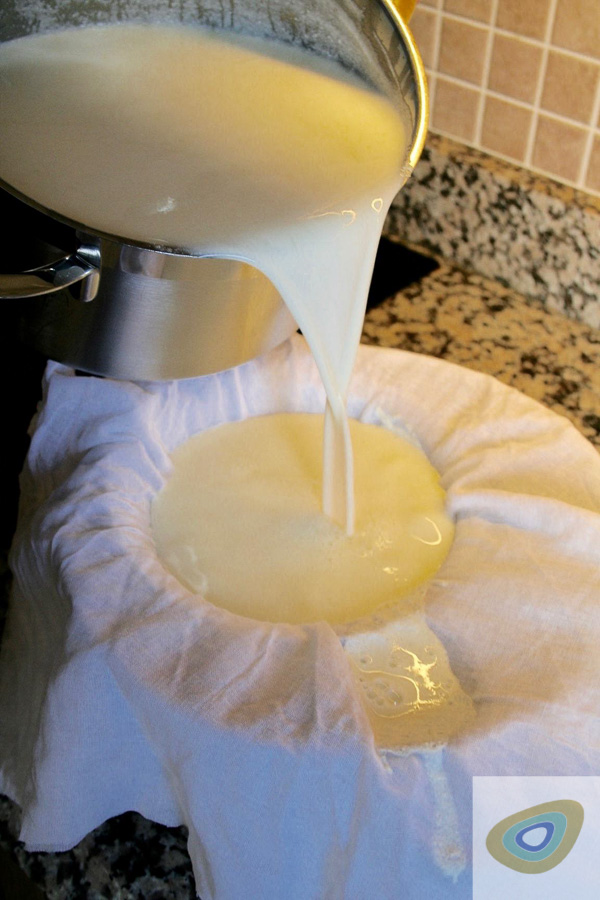 pouring milk mixture through muslin