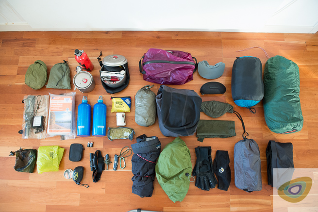 Backpacking kit laid out on floor