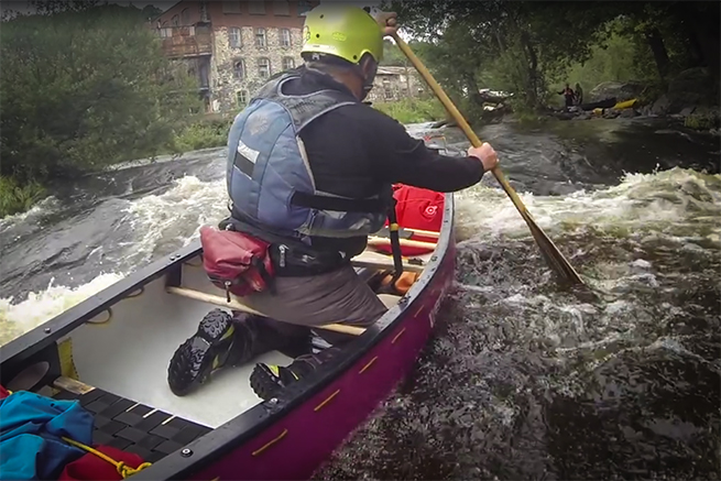 Ray Goodwin in canoe on a river in Wales