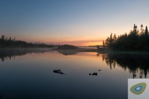 Misty sunrise on the Missinaibi river, Ontario, Canada