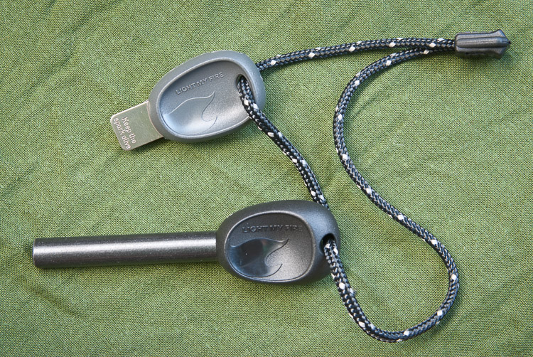 ferro rod and metal striker, both with ergonomic handle