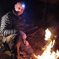 Man pleased with his fire-making